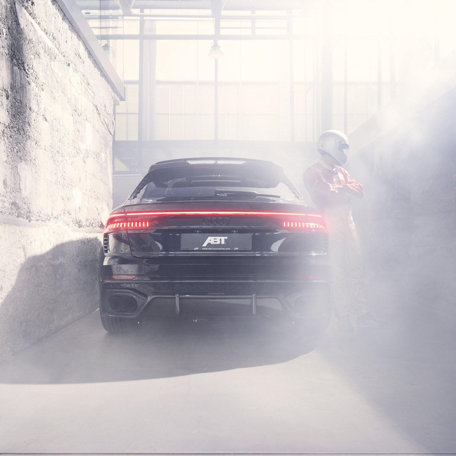 Black RSQ8 Siganture Edition from the rear view in a foggy hall